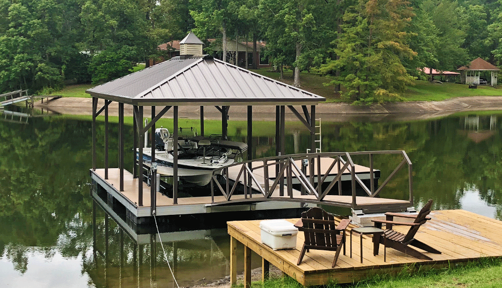 Single slip hip roof boat dock with burnished slate roof and posts, matched with buckskin decking - Dock Solutions of Kentucky | Lexington, KY