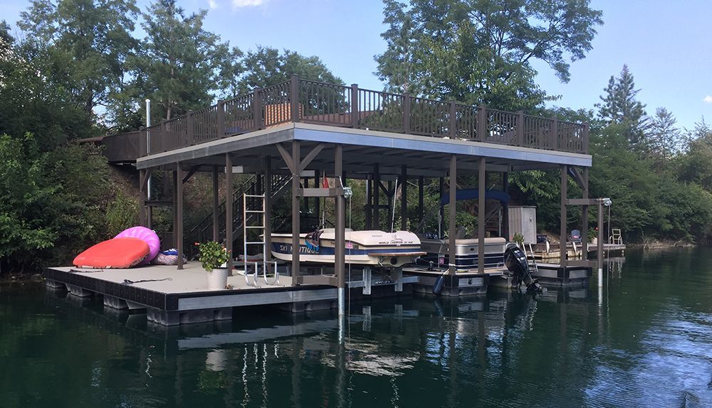 Double slip sundeck boat dock with full length swim platform and spud pole anchoring system - Dock Solutions of Kentucky | Lexington, KY