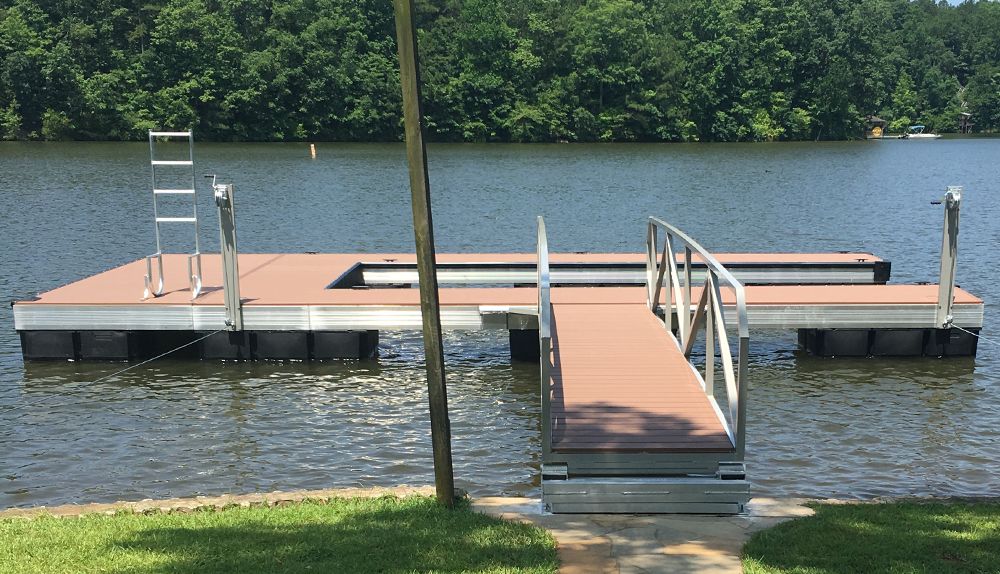 A dock on a lake with a ladder attached to it - Dock Solutions of Kentucky | Lexington, KY