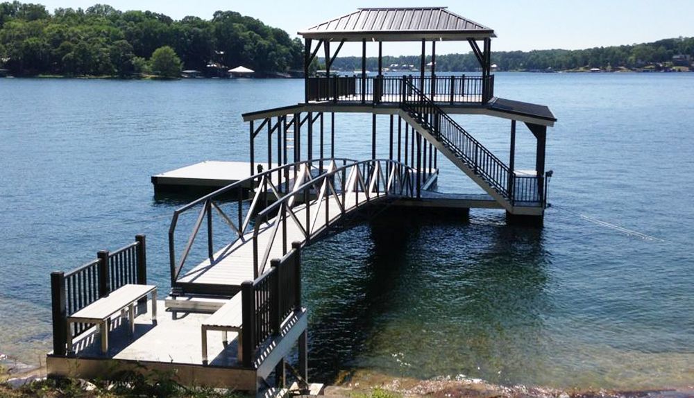 Granite gray decking with burnished slate roofs and railings. Shown with swim platform and a bank side platform equipped with dock benches. - Dock Solutions of Kentucky | Lexington, KY