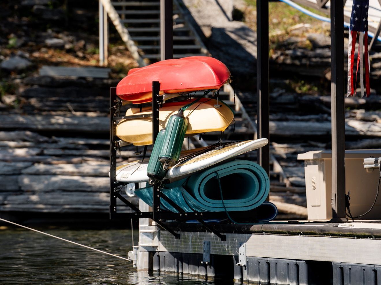Kayaks and Surfboards Are Stacked on Top of Each Other on A Dock - Dock Solutions of Kentucky | Lexington, KY