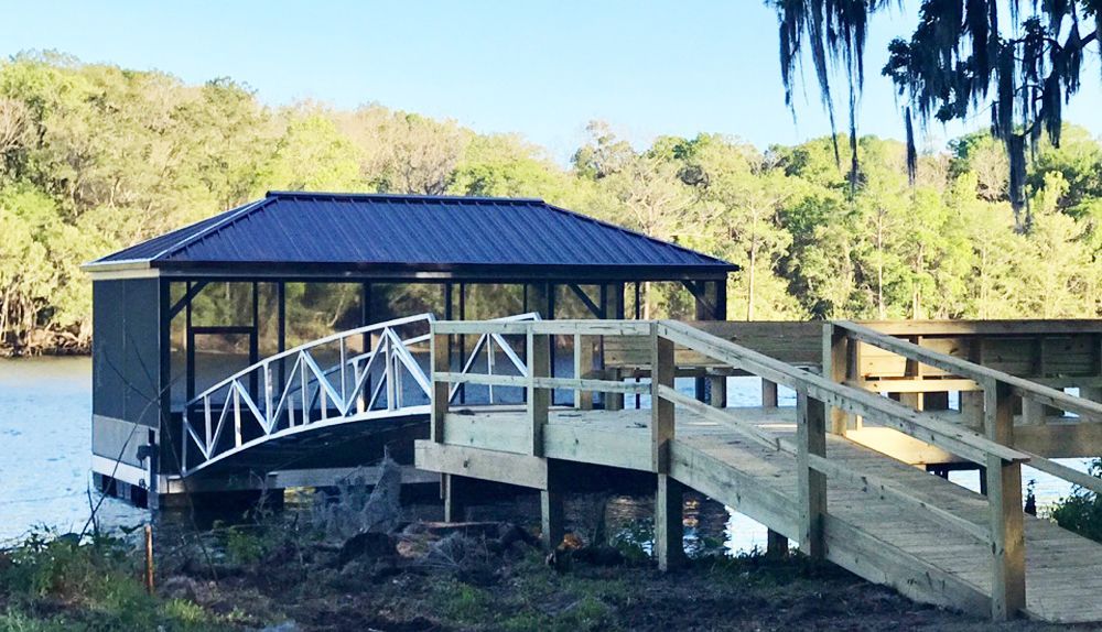Custom screened-in hip roof boat dock - Dock Solutions of Kentucky | Lexington, KY