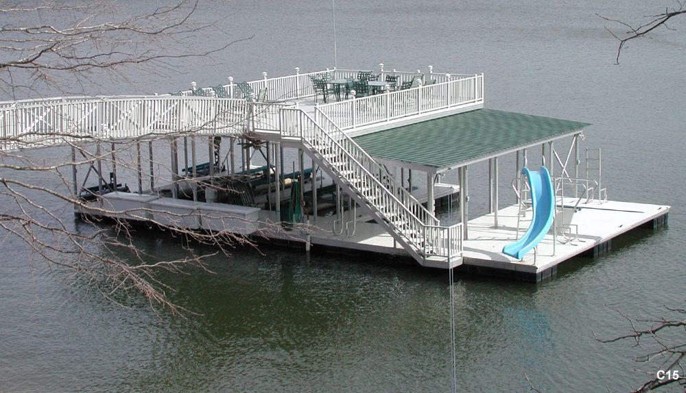 Silverstone decking and railing, hunter green roof, with swim platform, custom diving board and slide, and ramp pickets - Dock Solutions of Kentucky | Lexington, KY