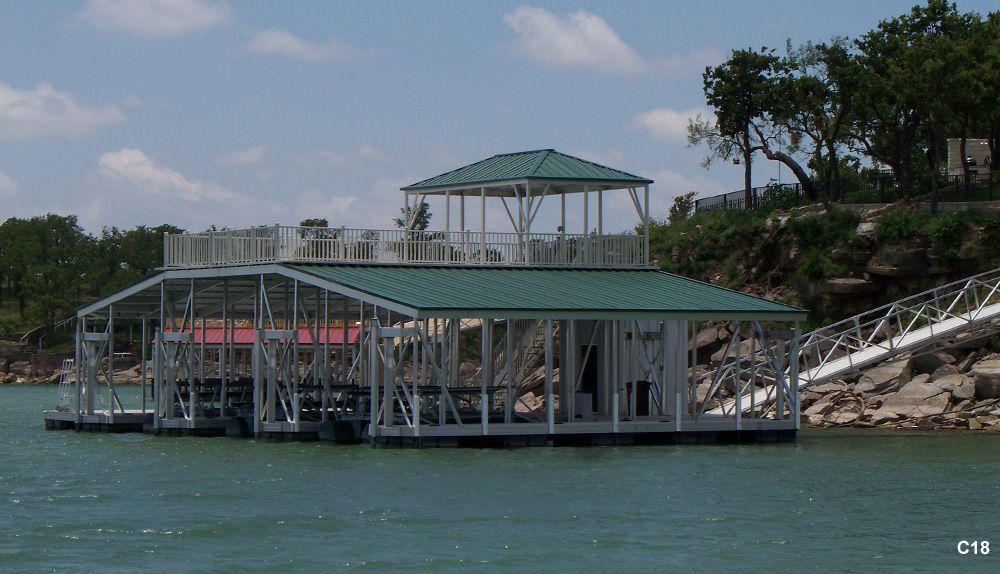 Silverstone decking and railing, hunter green roof, with swim platform, swim ladder, closet, and hip shade - Dock Solutions of Kentucky | Lexington, KY