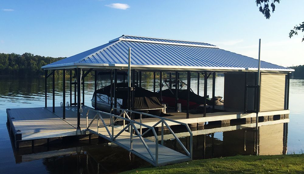 Double slip hip roof boat dock. Galvalume roof with black posts and granite gray decking - Dock Solutions of Kentucky | Lexington, KY