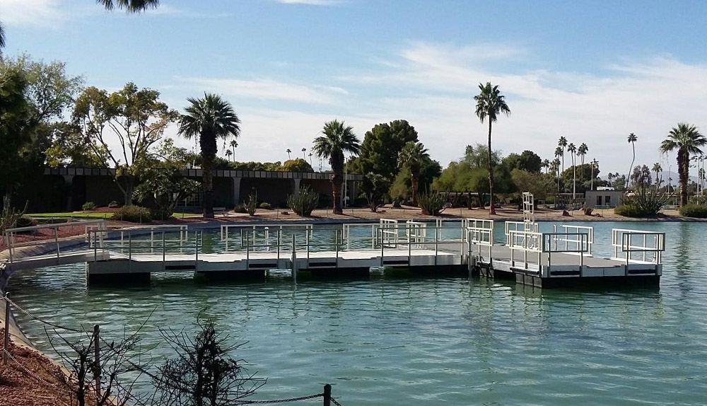 A dock in the middle of a lake with palm trees - Dock Solutions of Kentucky | Lexington, KY