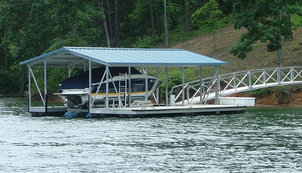 Silverstone decking, Hawaiian blue roof, with full-length swim platform, swim ladder, dog steps, large dock locker - Dock Solutions of Kentucky | Lexington, KY