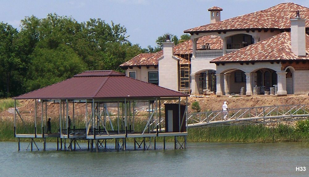 ckskin decking, Spanish tile roof, with arched Gothic-style braces and covered deck area - Dock Solutions of Kentucky | Lexington, KY