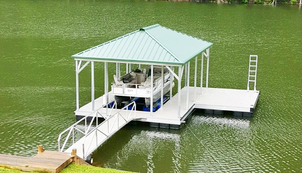 Single slip hip roof boat dock with hunter roof panels and silverstone decking - Dock Solutions of Kentucky | Lexington, KY
