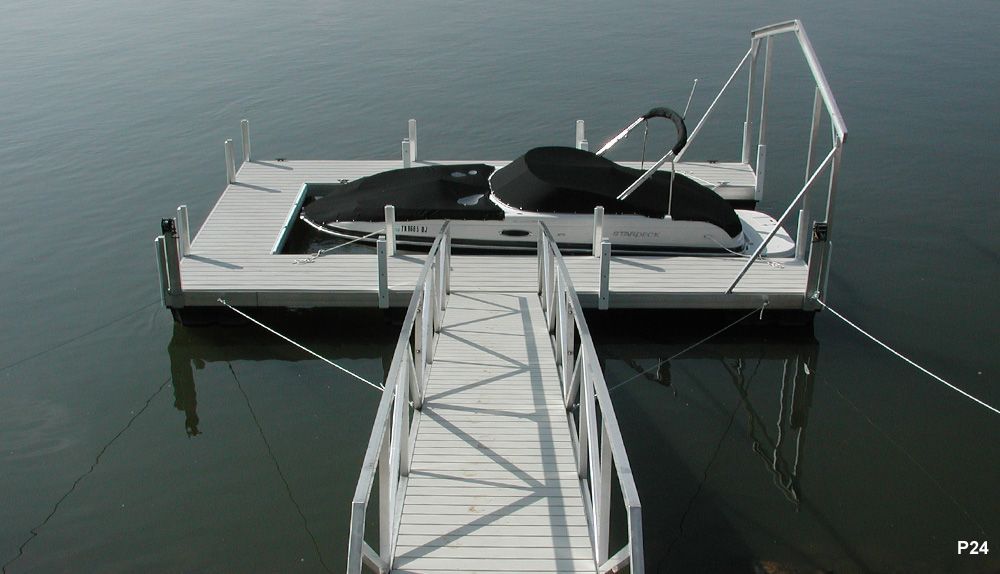 A boat is docked at a dock in the water - Dock Solutions of Kentucky | Lexington, KY