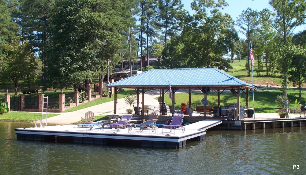 Dock with A Blue Roof Sits in The Middle of A Lake - Dock Solutions of Kentucky | Lexington, KY