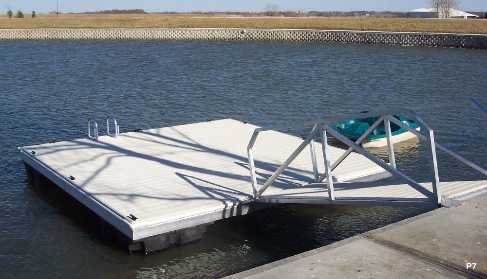 Boat Is Sitting on A Dock in The Water - Dock Solutions of Kentucky | Lexington, KY