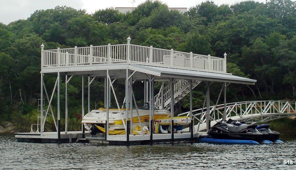 Silverstone decking and railings, with swim platform, swim ladder, and roof overhand to cover PWCs - Dock Solutions of Kentucky | Lexington, KY