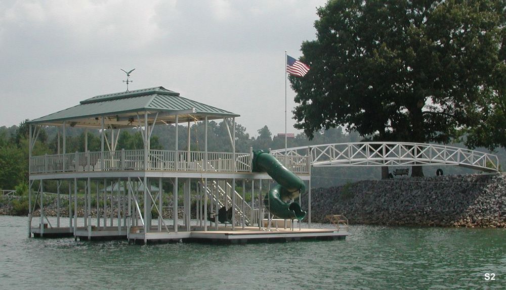 Buckskin decking, hunter roof, silverstone railings, with swim platform, dog steps, custom slide, and hip shad with decorative ridge - Dock Solutions of Kentucky | Lexington, KY