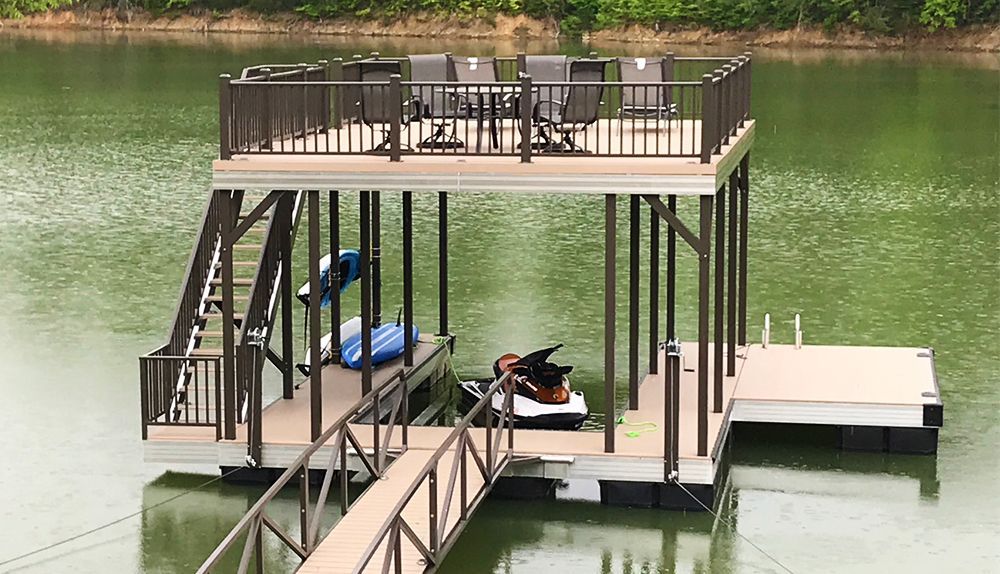 Single slip sundeck boat dock with buckskin LockDry aluminum decking and burnished slate posts and railing. - Dock Solutions of Kentucky | Lexington, KY