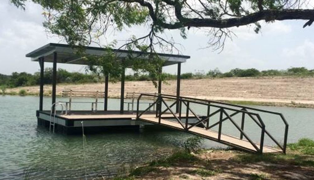 A dock with a bridge over a body of water - Dock Solutions of Kentucky | Lexington, KY