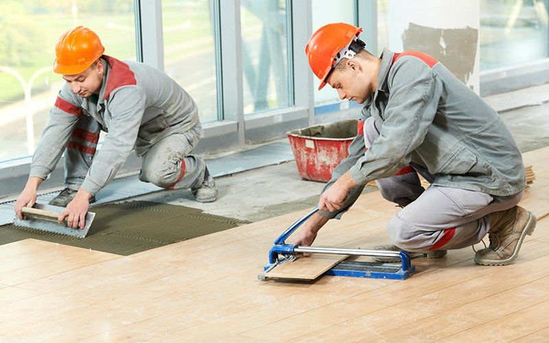 Workers Installing New Floor — San Diego, CA — Click On Floor