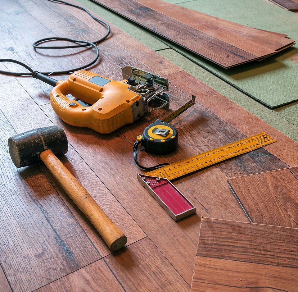 Laminate Floors — Different Carpenter Tools On Floor in San Diego, CA Laminate Floors — Different Carpenter Tools On Floor in San Diego, CA