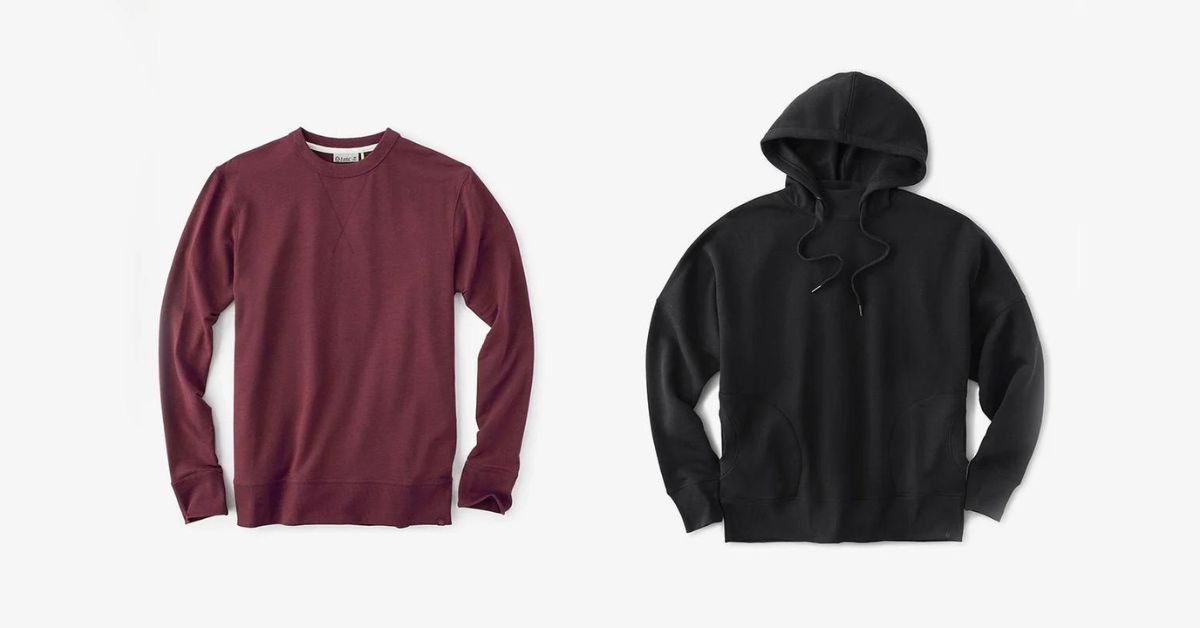 A red long sleeve shirt and a black hoodie are on a white background.