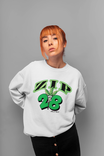 A woman is wearing a white zip 28 sweatshirt.