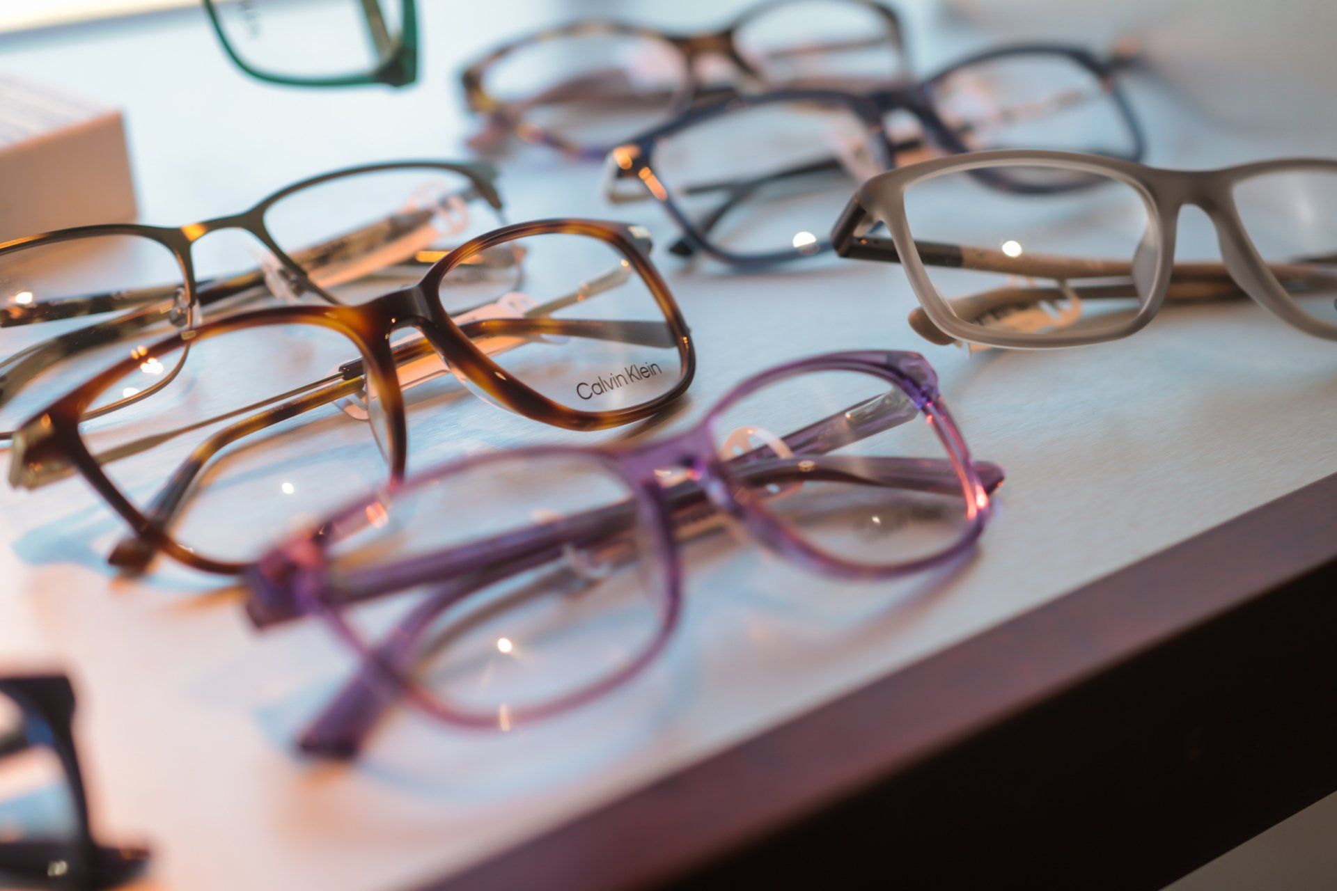 A bunch of glasses are sitting on top of a table.