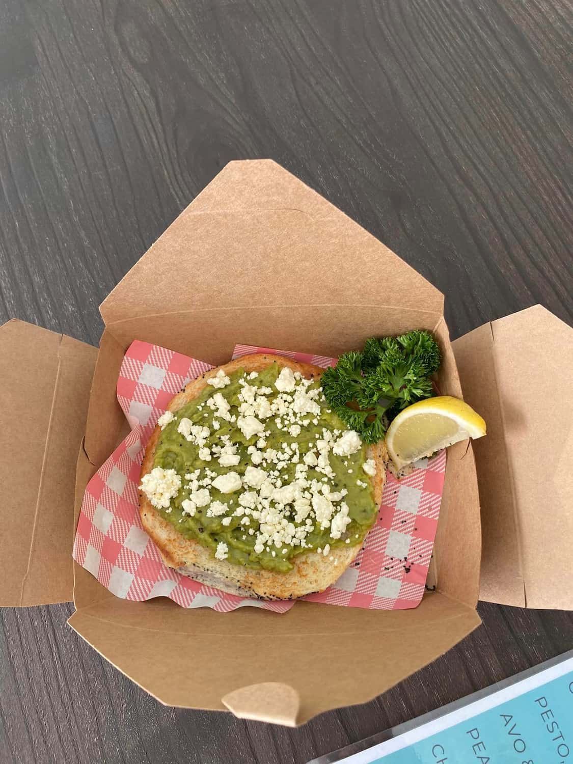 A Sandwich In A Box Placed On A Table — Independent Beans in Kirwan, QLD