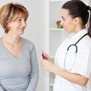 Mature woman with her female doctor.-USA