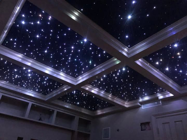 A kitchen with white cabinets , granite counter tops , stainless steel appliances and a large island.