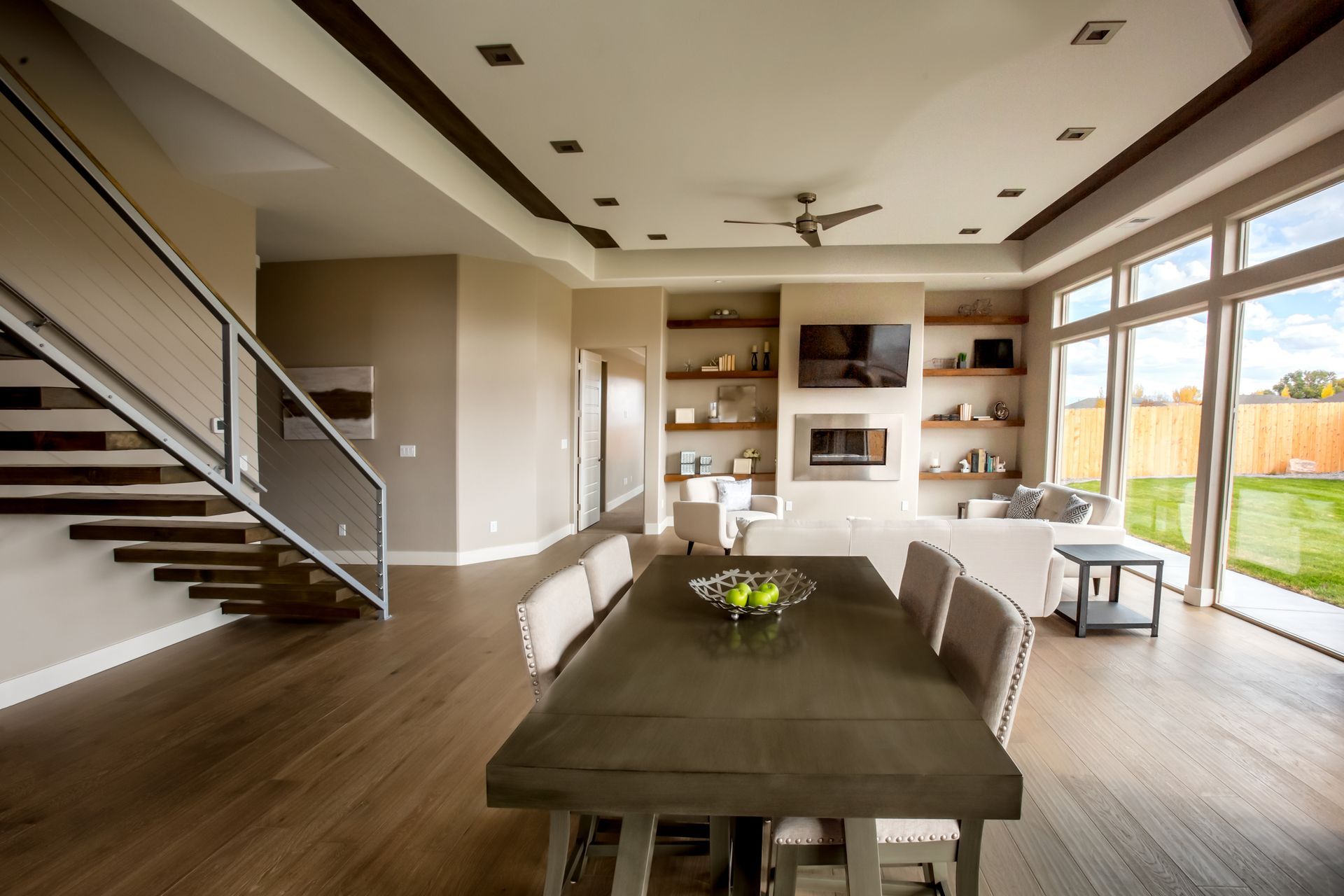 A large living room with a dining table and chairs