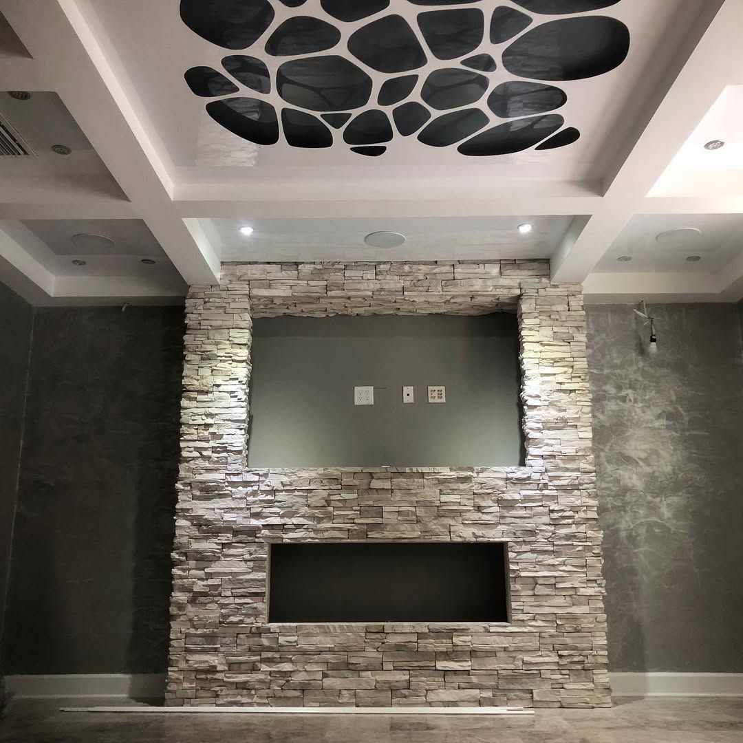 A purple house with a concrete driveway and a lush green lawn.