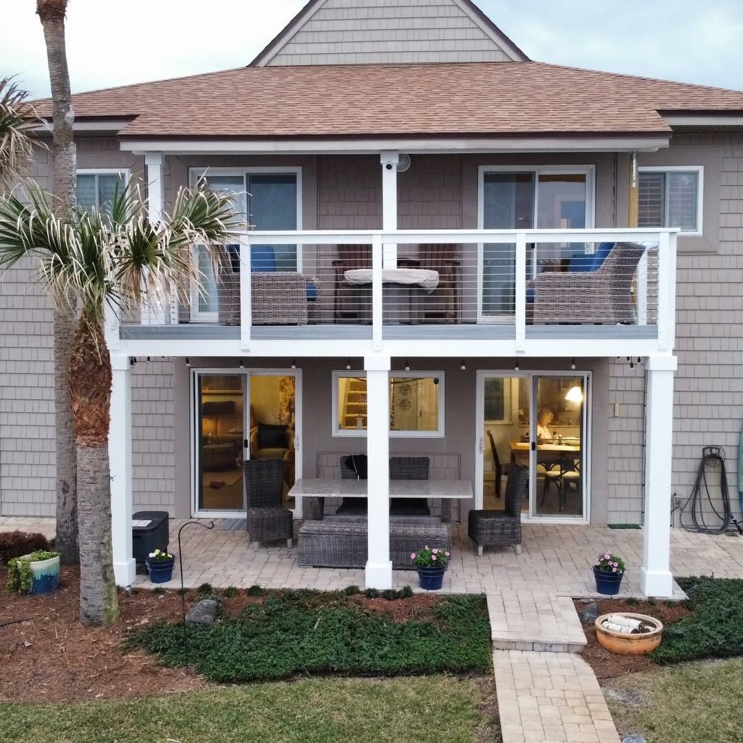 A living room with a dining table and chairs