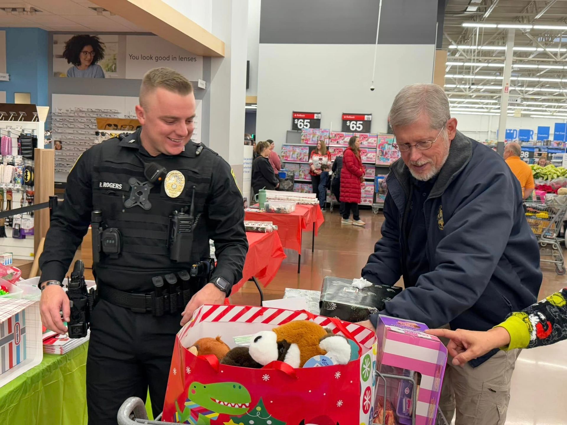 A police officer and a man are standing next to each other in a store.