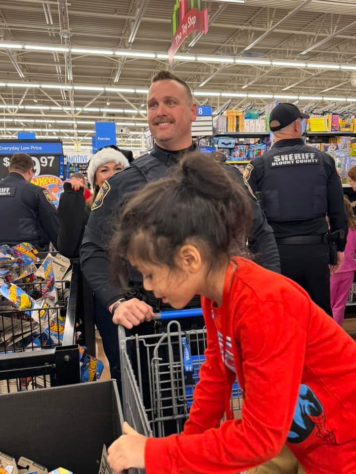 A man and a little girl are shopping in a store.