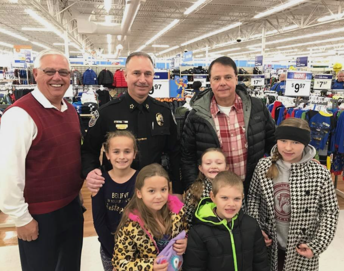 A group of people posing for a picture in a store
