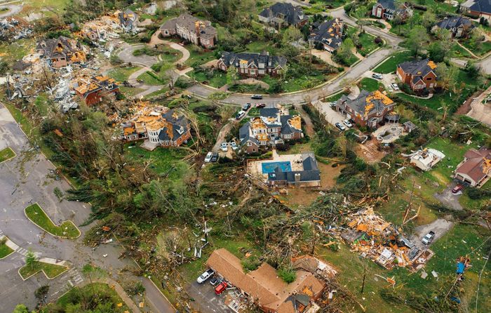 An aerial view of a residential area damaged by a tornado.