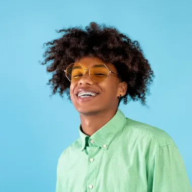 Teenage boy with braces and sunglasses on