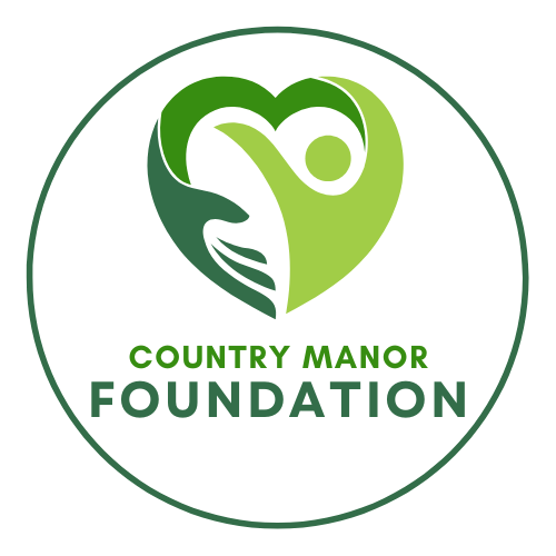 The country manor foundation logo is a green heart with two hands holding it.