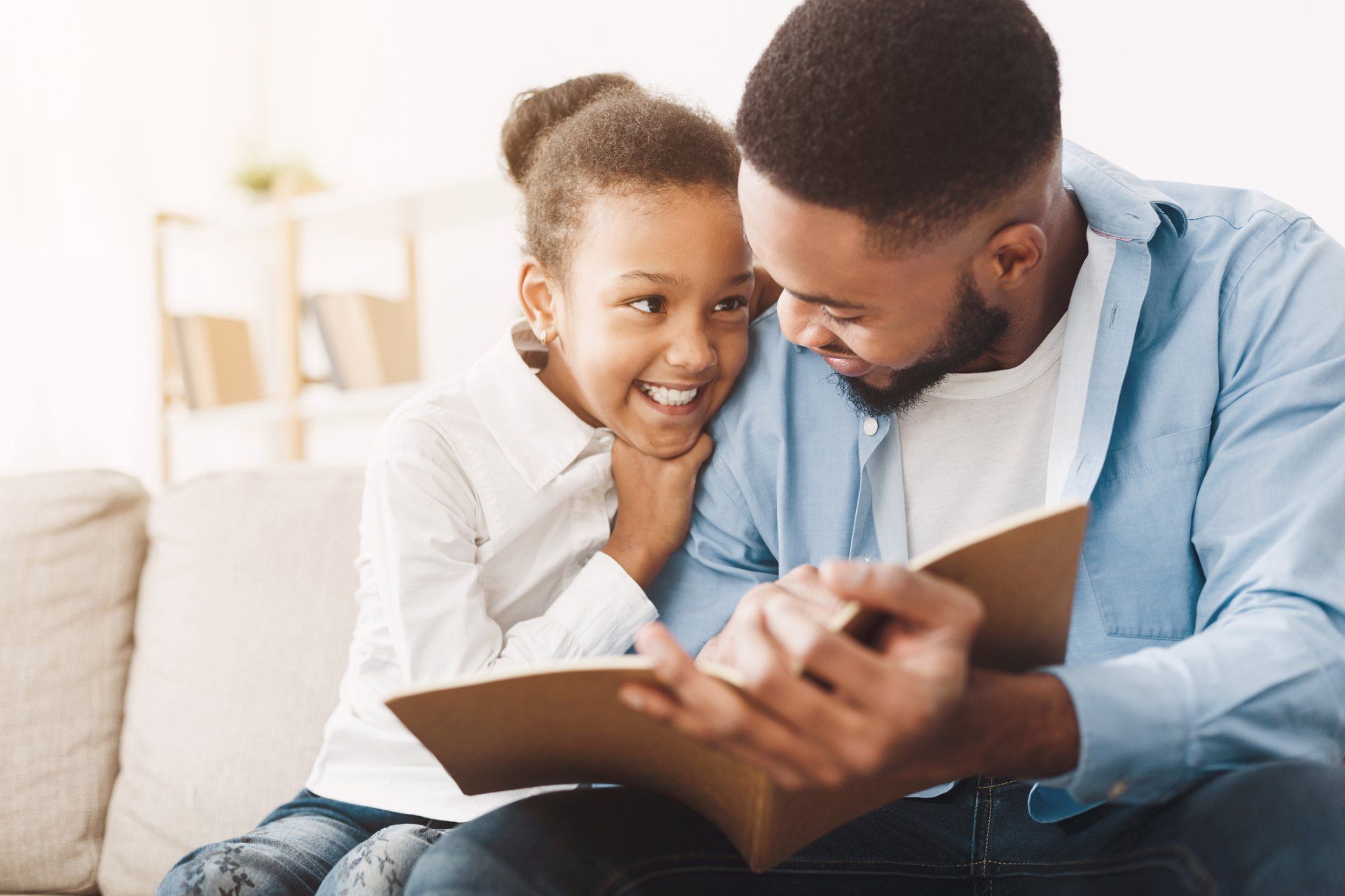 Father and daughter reading a book