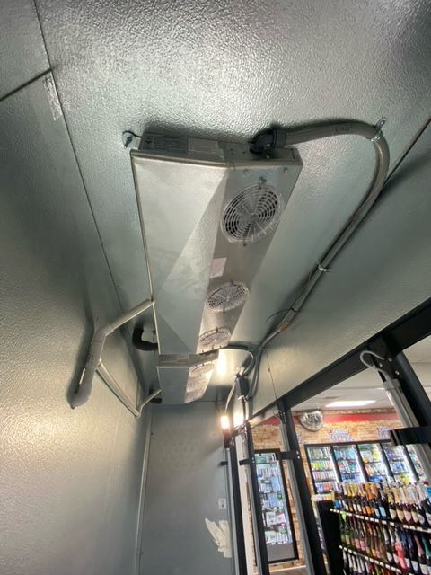 view of a commercial refrigerator cooling unit