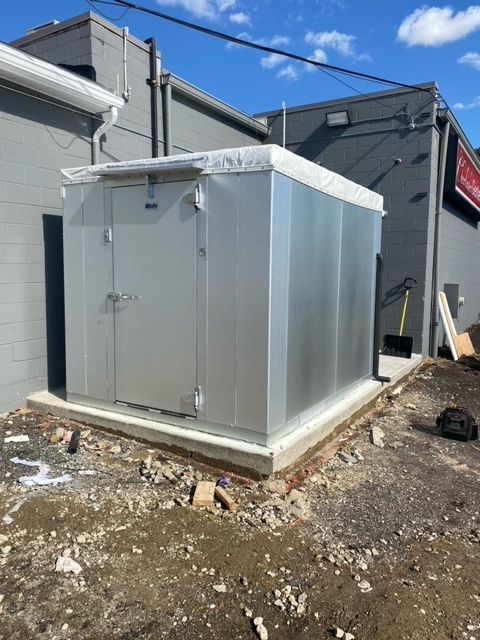 View of a walk in commercial refrigeration unit located outside