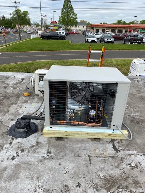 commercial refrigeration unit finished maintenance on from the roof