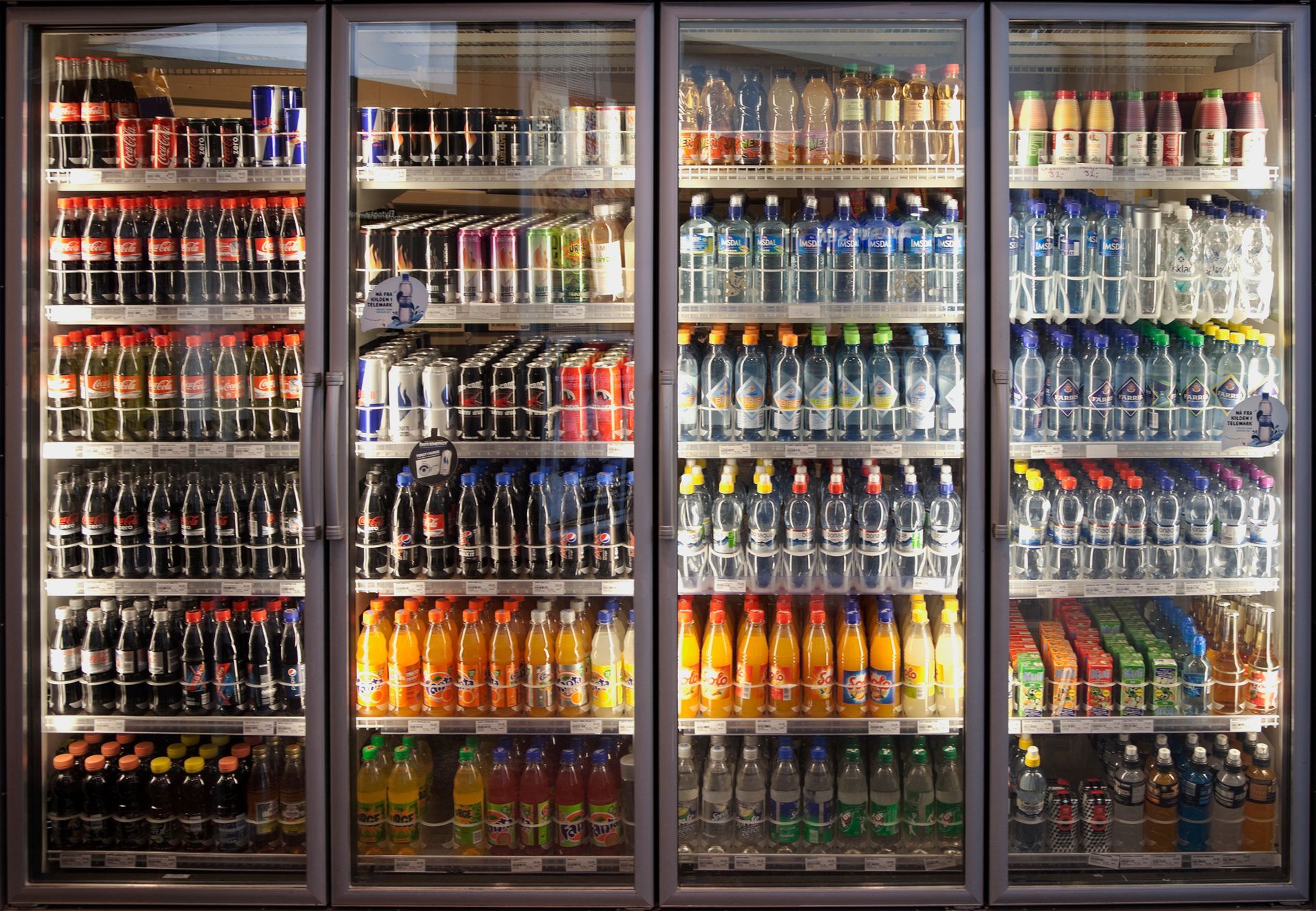 Commercial beverage cooler with drinks on display in a Philadelphia business.