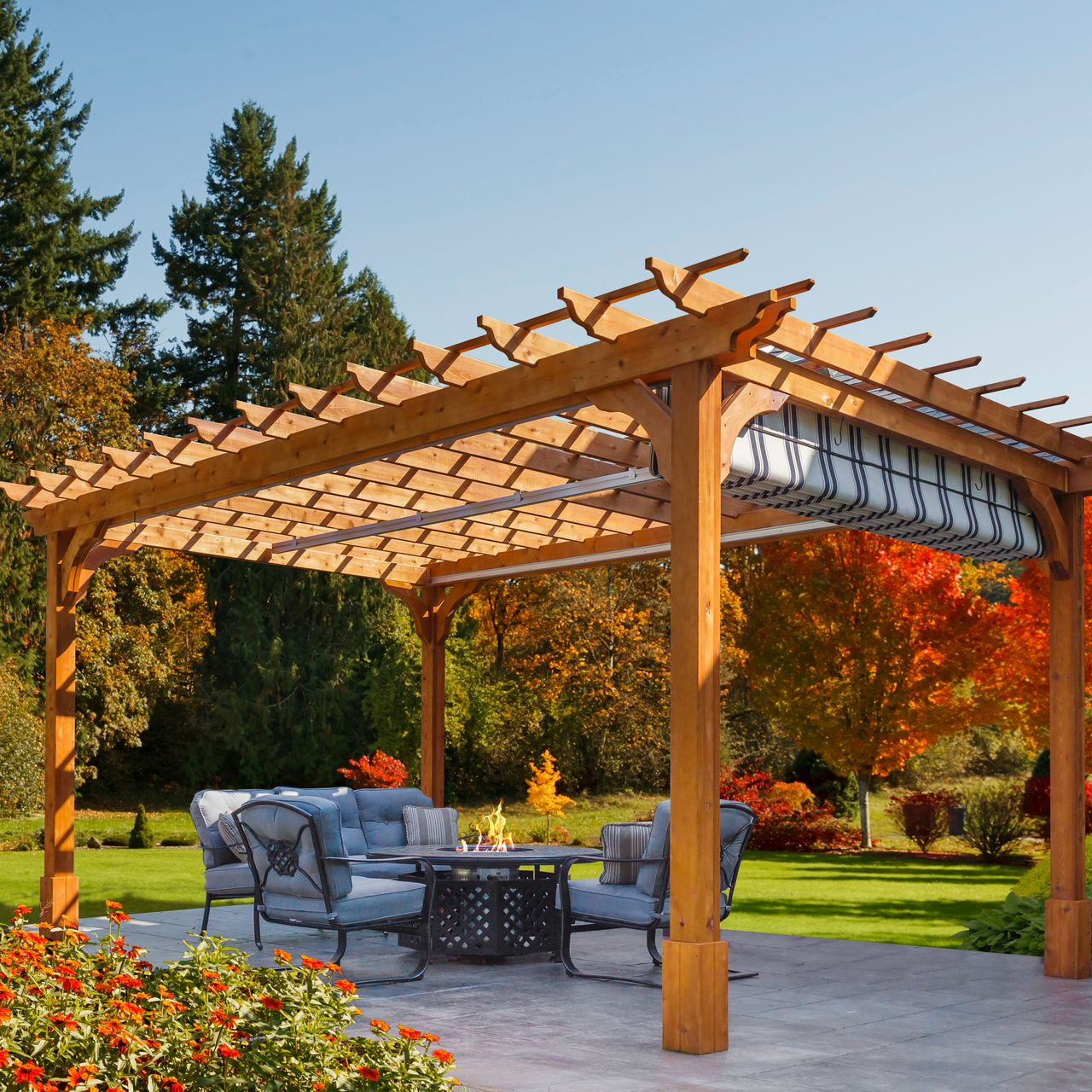 A gazebo with a table and chairs in the middle of a grassy field