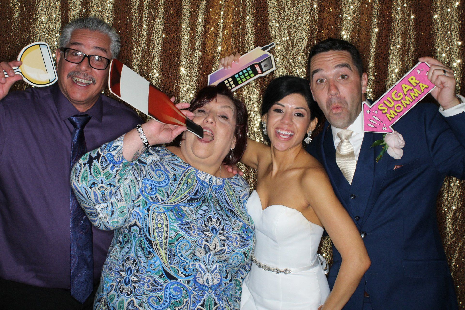 wedding guests having fun in photo booth