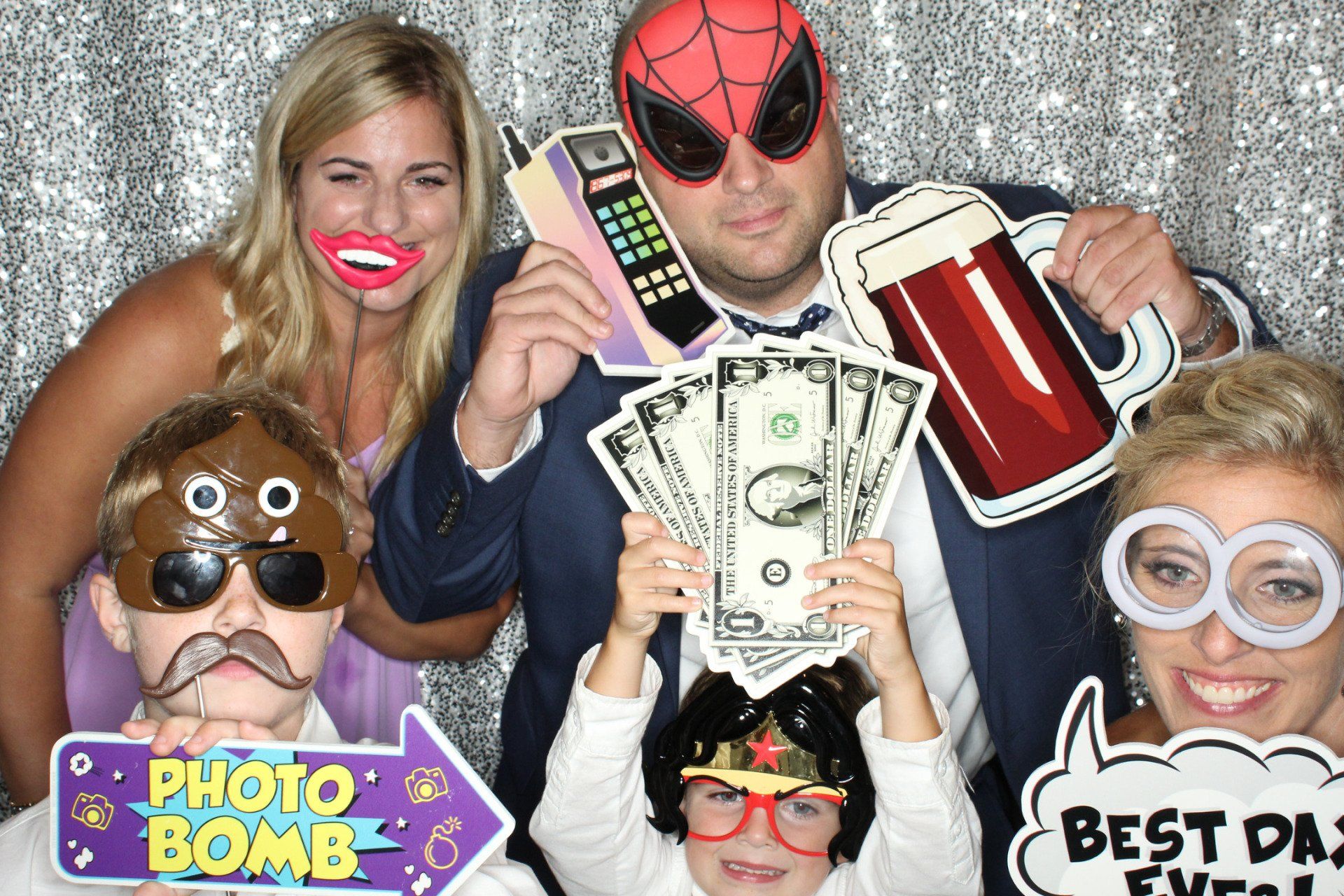 wedding guests having fun in photo booth