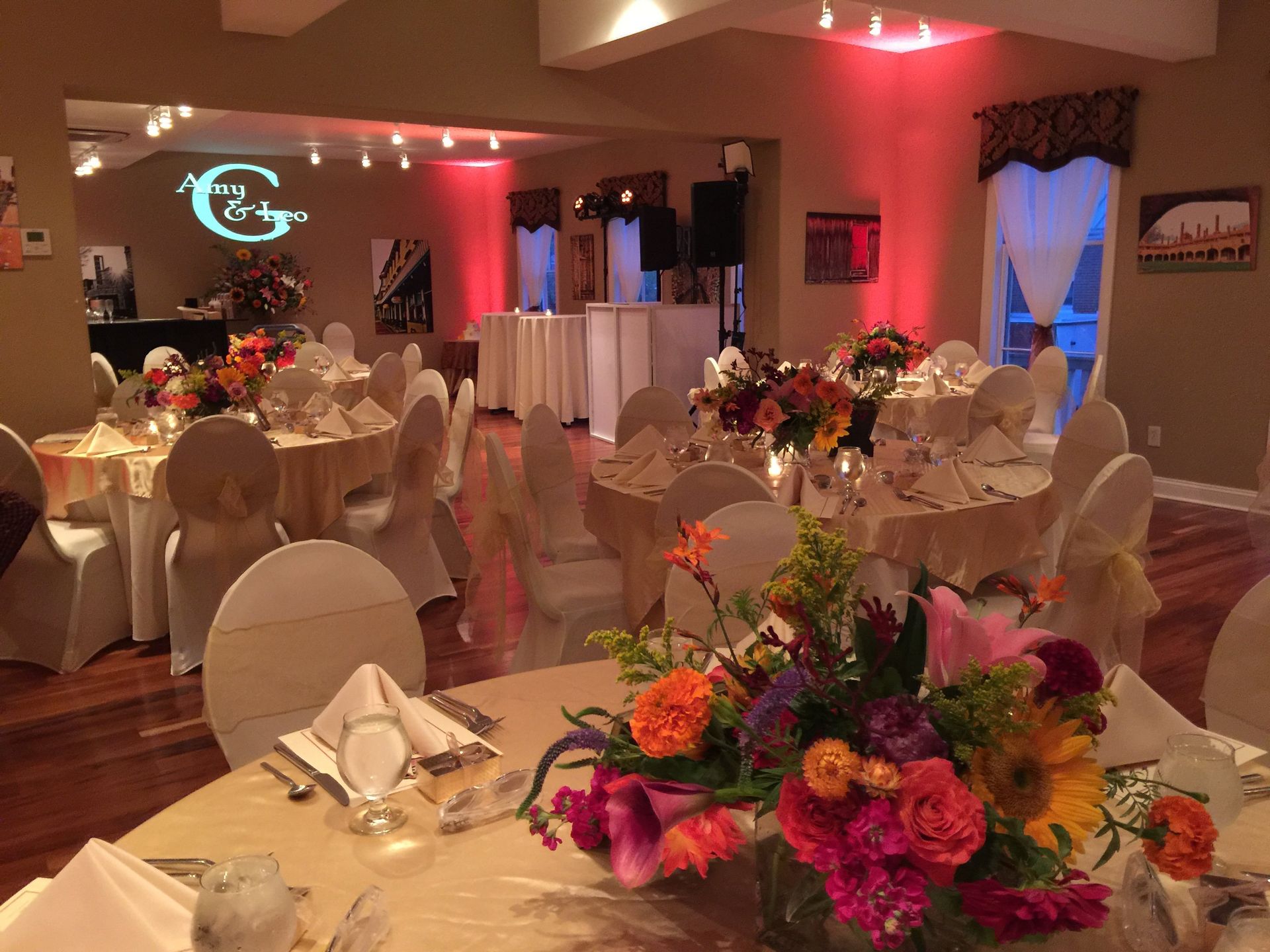 small wedding venue with up lighting and custom monogram