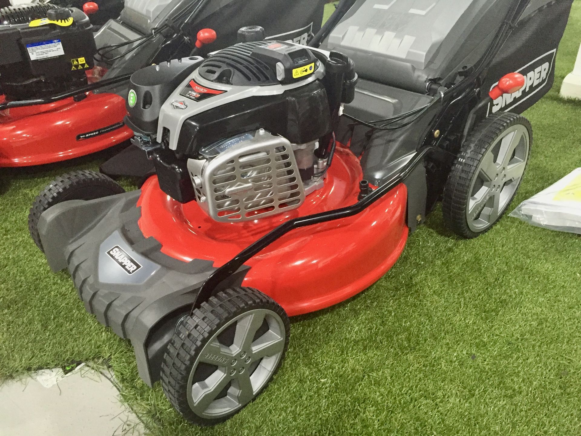 Photograph of a petrol engined, Snapper rotary lawn mower.