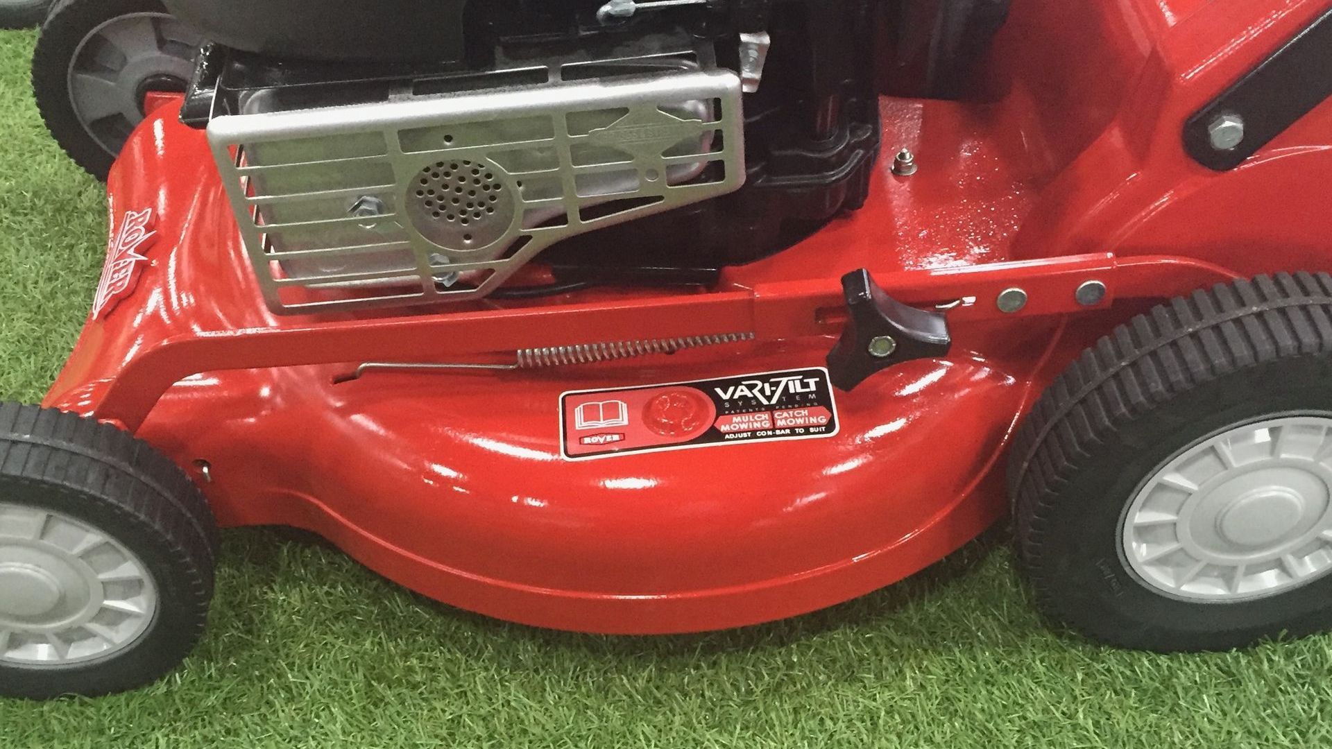 Photograph of an aluminium alloy cutting deck, fitted to a Rover Regal lawnmower.