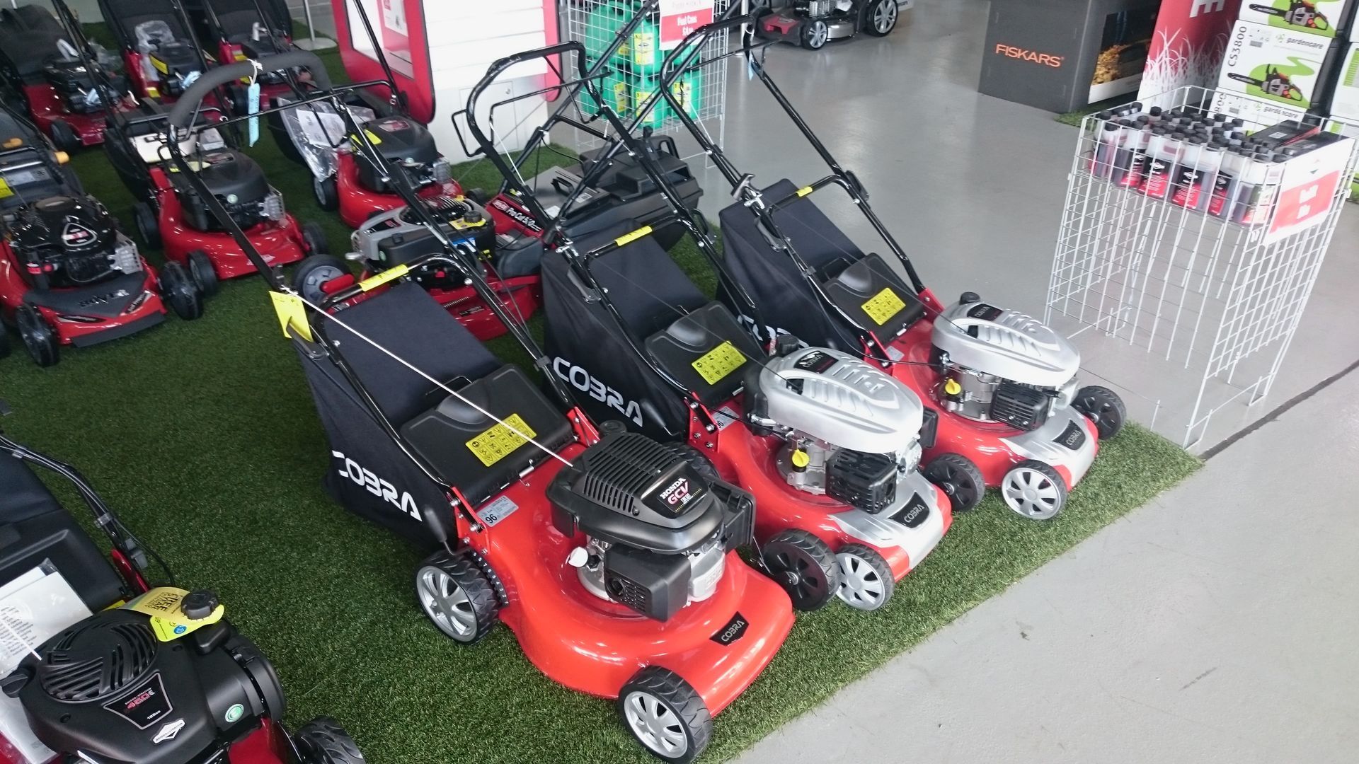 Photograph of Cobra petrol engine lawnmowers on sale at Cyril Johnston near Carryduff, Belfast, UK.