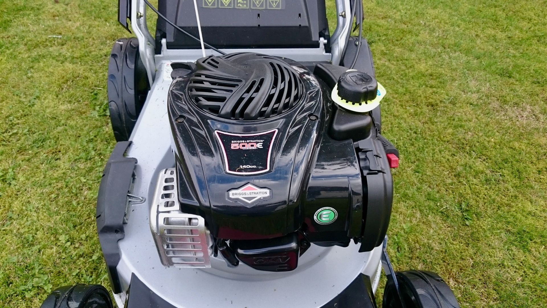 Photograph of a Briggs & Stratton 500E petrol engine, fitted to a World brand, 48cm, self-propelled lawnmower.